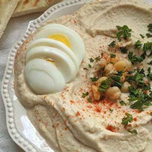 hummus on a plate with egg