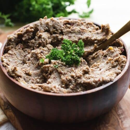 mocked chopped liver in a brown bowl with a spoon in the center