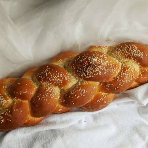 challah bread on a white tablecloth