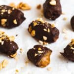 dates dipped in chocolate with crushed peanuts