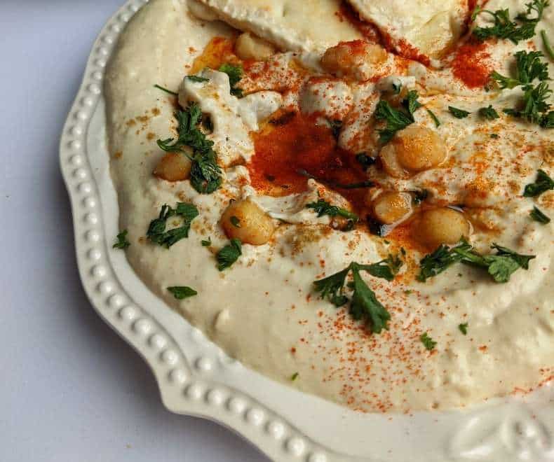 Hummus on a white plate