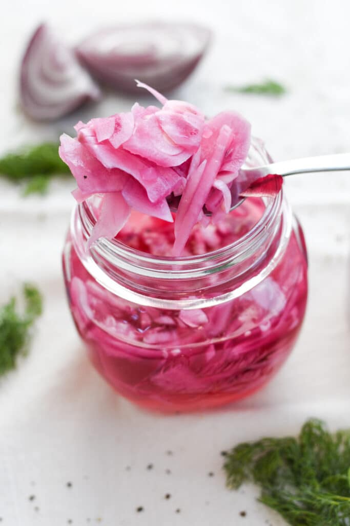 Red pickled onions in a jar 