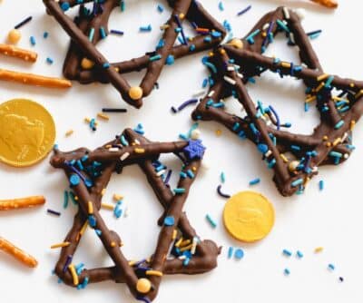 Star of David Pretzels with sprinkles on a white paper