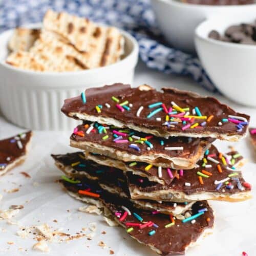 a pile of Toffee Matzo Brittle with sprinkles