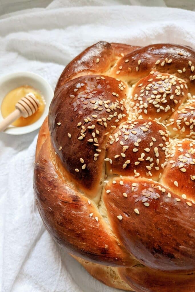 Round challah with honey on the side