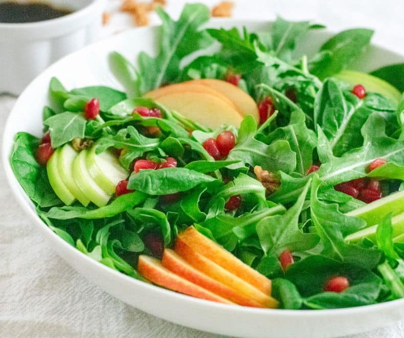 Apple Pomegranate Salad in a white bowl