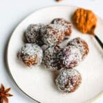 No-Bake Energy Balls on a white plate with a teaspoon