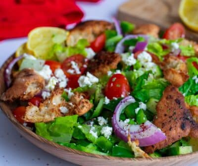 Fattoush Salad with Feta in a brown bowl