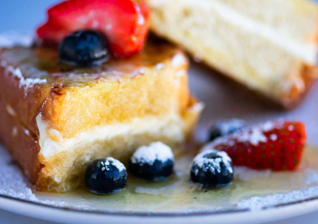 Stuffed Challah French Toast with berries and maple syrup