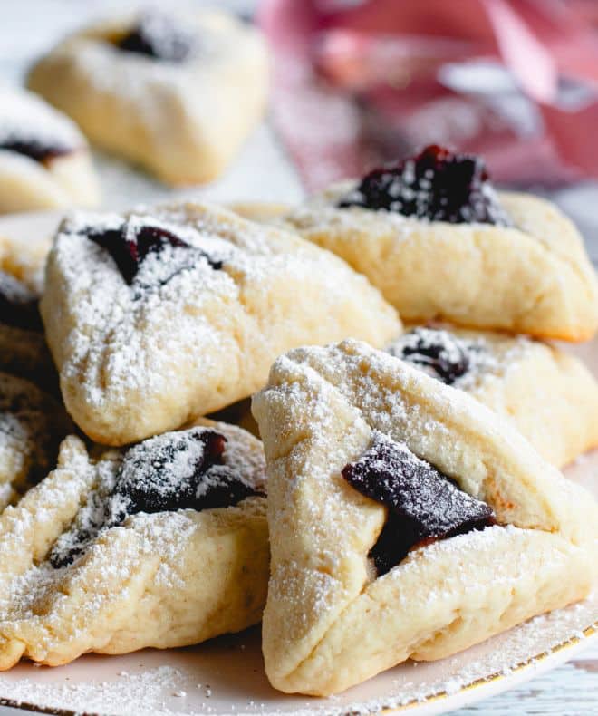 Hamantaschen with brown filling with powdered sugar